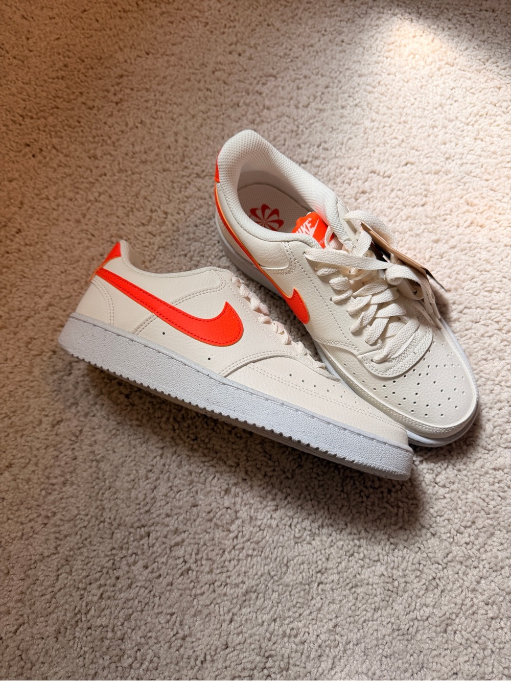 Nike White Low-Top Sneakers with Neon Orange Swoosh & Baby Blue Base